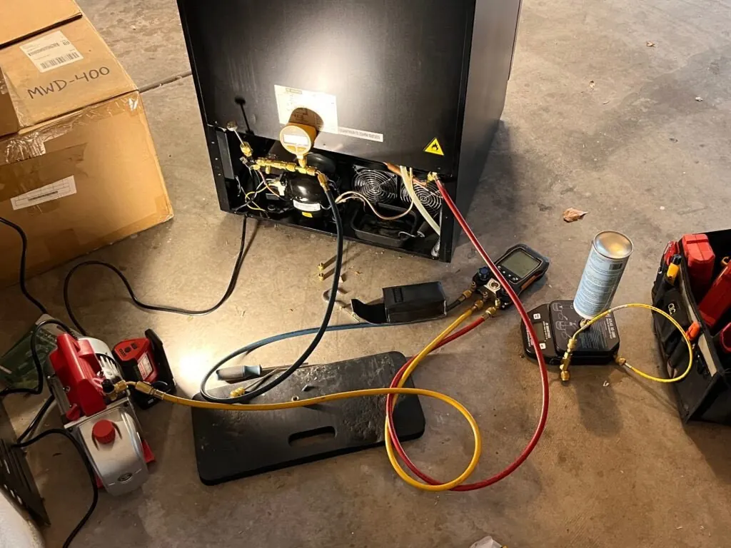 Compressor replacement in progress on an Allavino wine refrigerator in Las Vegas
