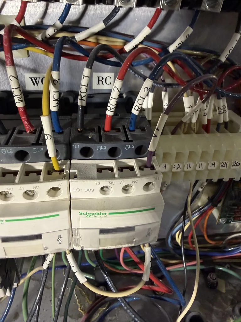 Rinse heater contactor in the electrical panel of a Douglas commercial dishwasher