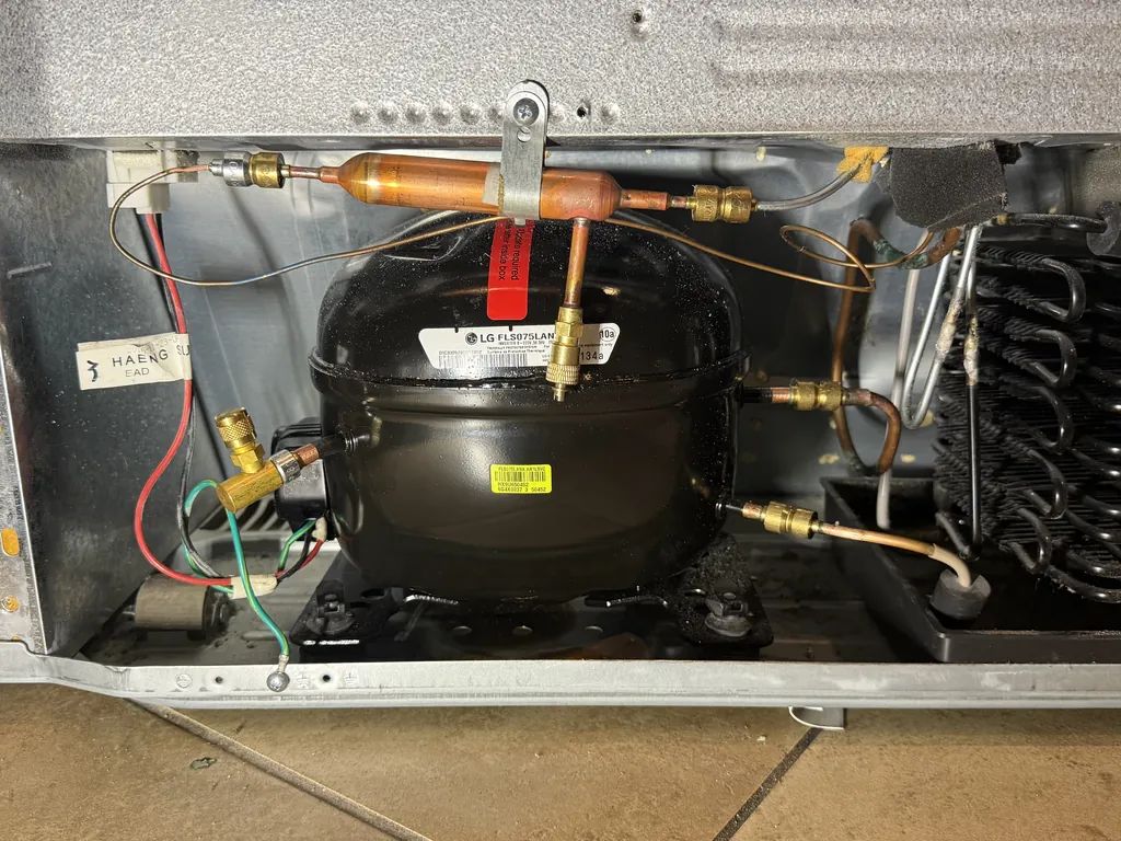 New compressor installed in an LG refrigerator in Las Vegas with brass Lokring fittings instead of brazing