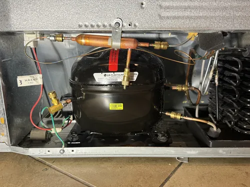 New compressor installed in an LG refrigerator in Las Vegas with brass Lokring fittings instead of brazing