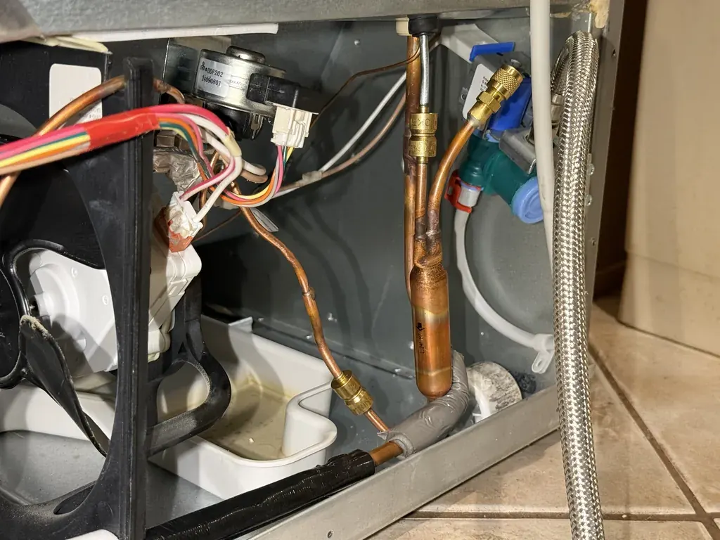 Lokring connections on a new filter drier in a built-in refrigerator machine compartment