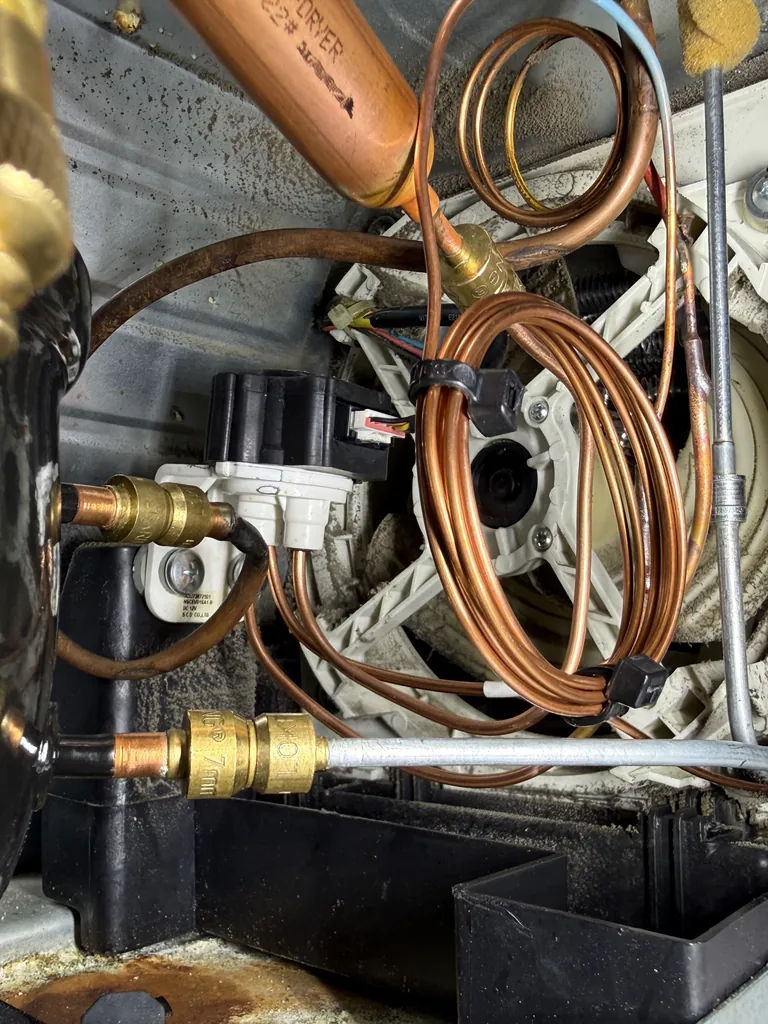 Lokring fittings on the filter drier and process tubes of an R600a refrigerator sealed system