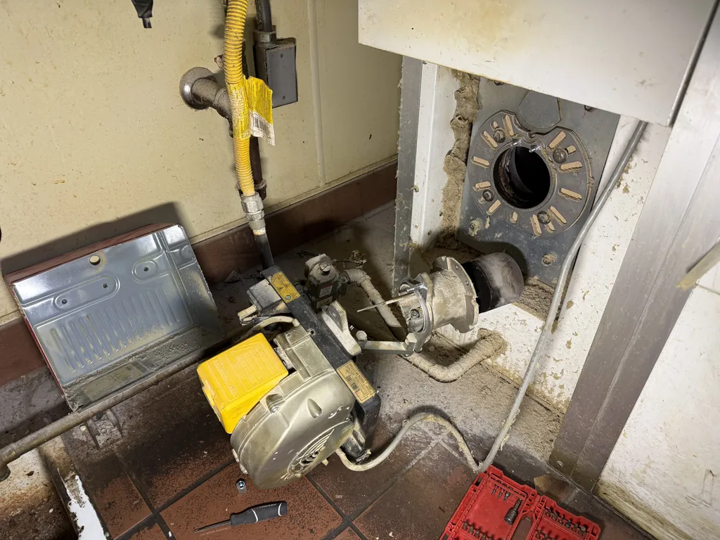 Gas burner assembly removed from a Polin rotating rack oven for cleaning