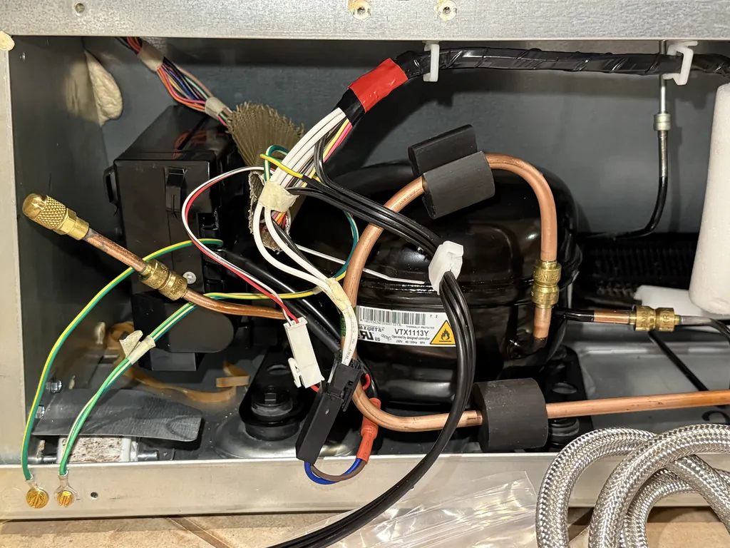 New R600a compressor installed in a built-in refrigerator with brass Lokring fittings instead of brazed joints